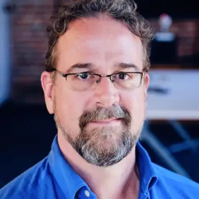 Portrait of Clayton Stark, CTO of Tilting Point